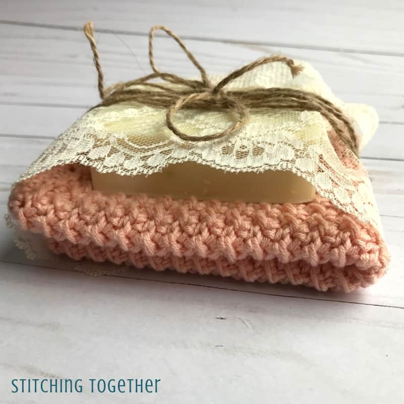 cute crochet washcloth and bar of soap wrapped with lace and jute