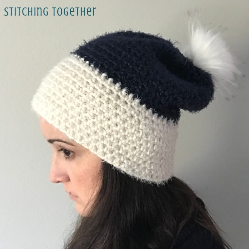 side view of hdc slouchy hat in white and blue 