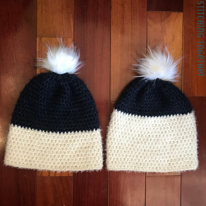 two blue and white half double crochet beanies