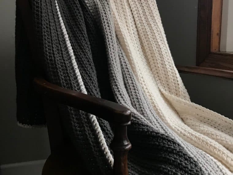 Gray Ombre half double crochet blanket draped on a chair