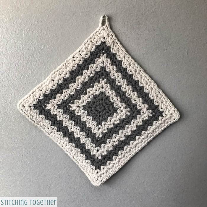 gray and white Crochet Potholder hanging