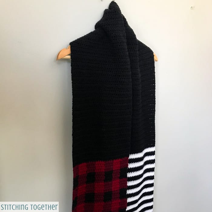 black and white striped crochet scarf with buffalo plaid and black