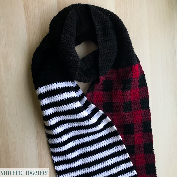 black and white striped crochet scarf with buffalo plaid and black 