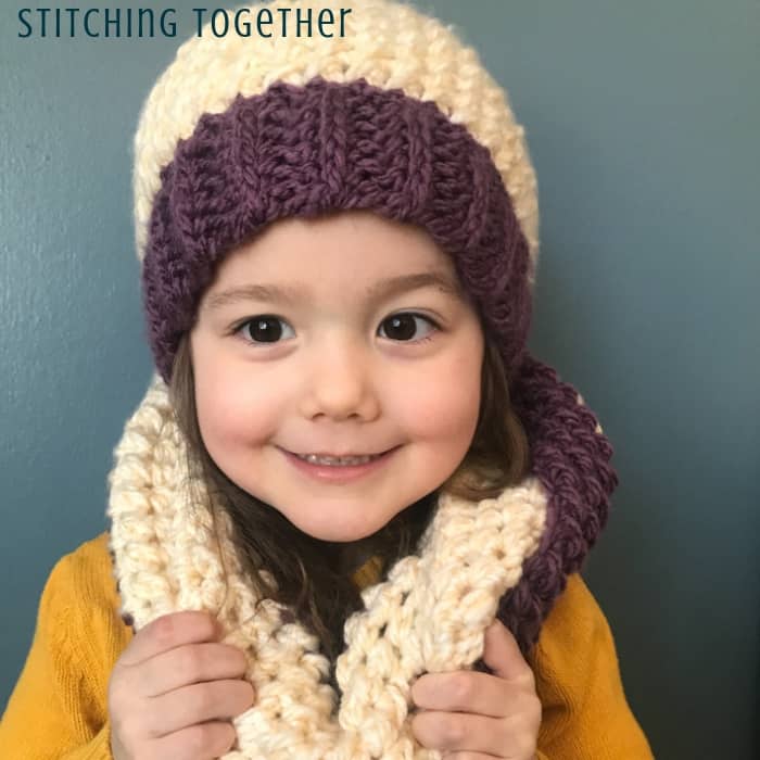 girl wearing chunky crochet scarf and hat