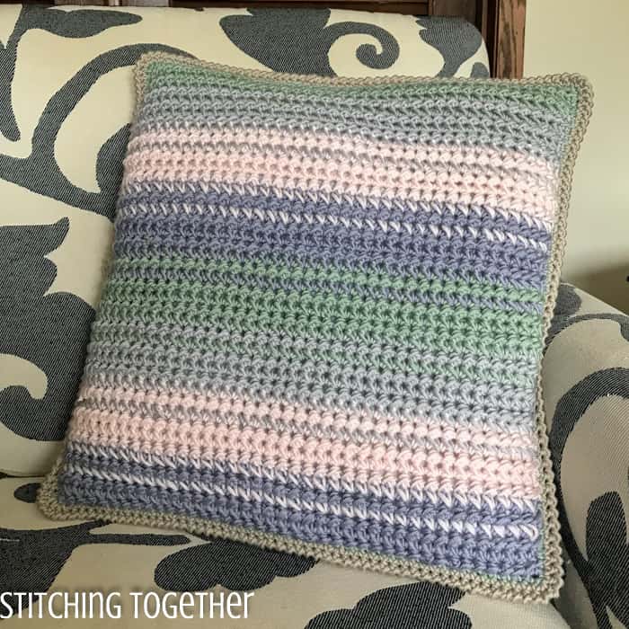 striped crochet pillow cover on chair