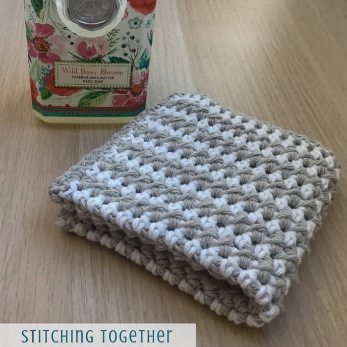 crochet washcloth and a bottle of hand soap