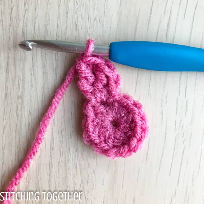 tall stitches being added to a crochet circle