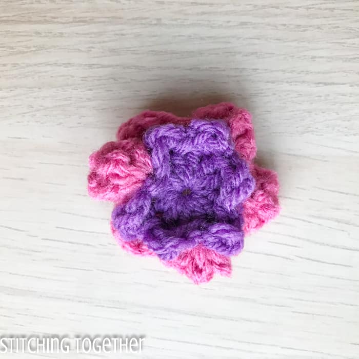 squished purple and pink crochet flower