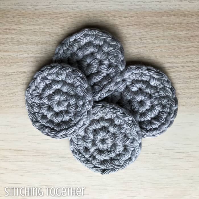 four gray round crochet crochet facial cleansing pads