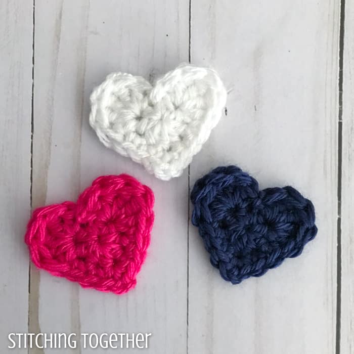 pink blue and white small crochet hearts