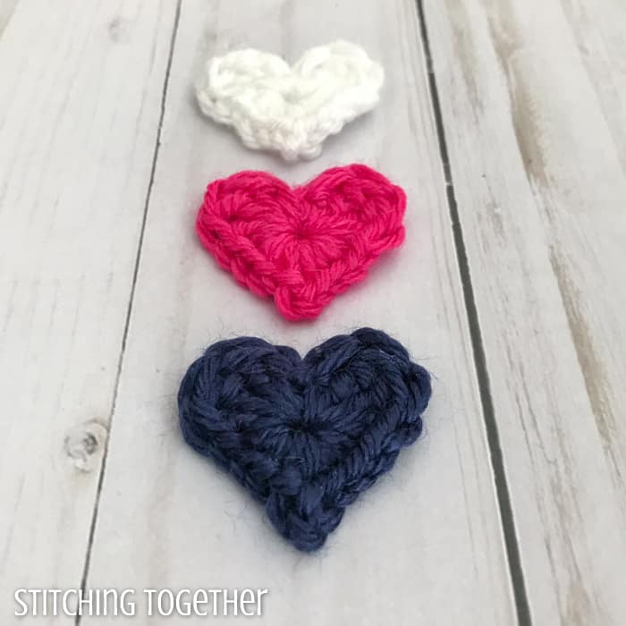 3 tiny crochet hearts in a line