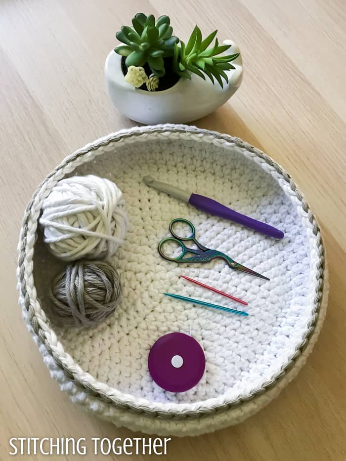 shallow crochet bowl holding crochet tools