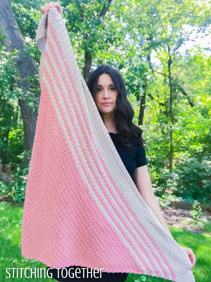 lady holding a triangle shawl