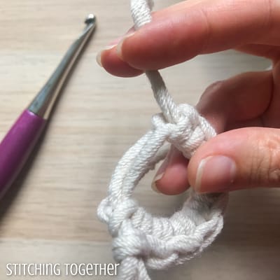 single crochets in a magic ring pulling tail end