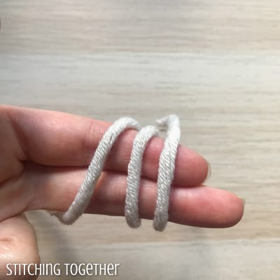 yarn wrapped around two fingers