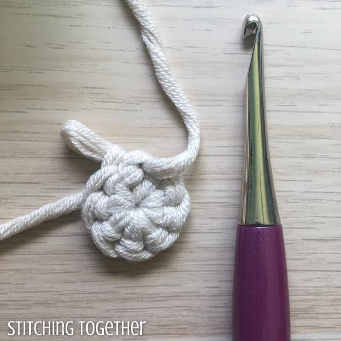 crochet magic loop next to a furls crochet hook
