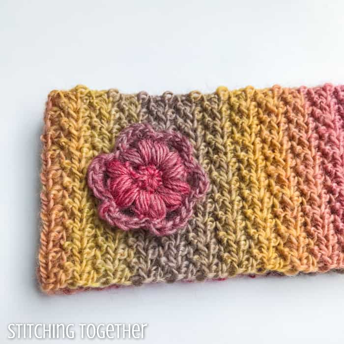 bright crochet ear warmer headband with flower