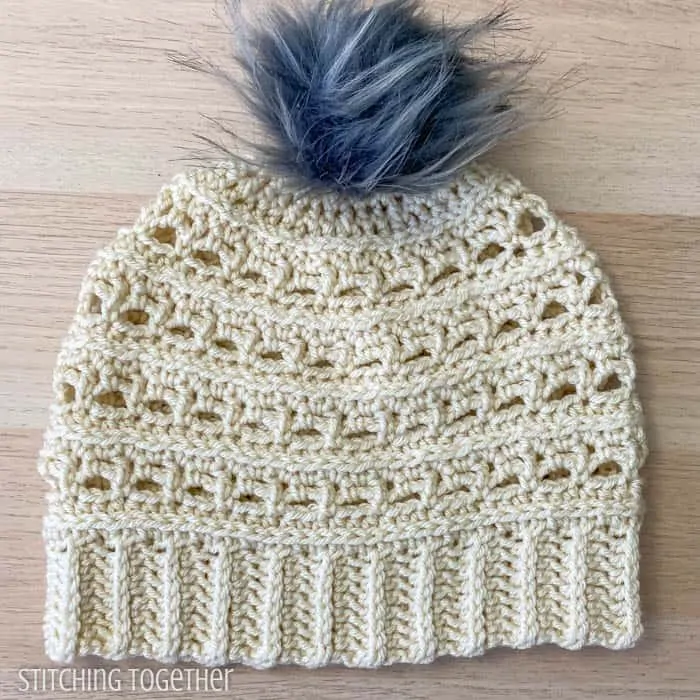 woman crochet beanie with pom pom