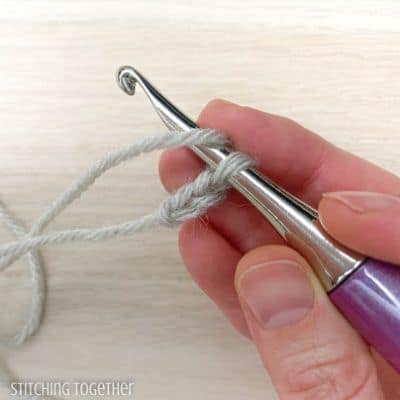crochet hook with yarn and 2 chains