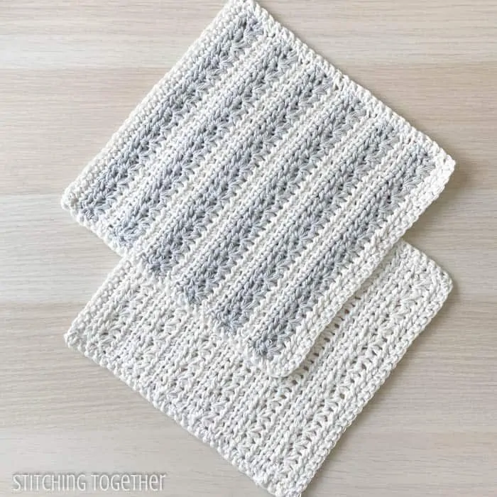 two textured crochet dishcloths laying flat