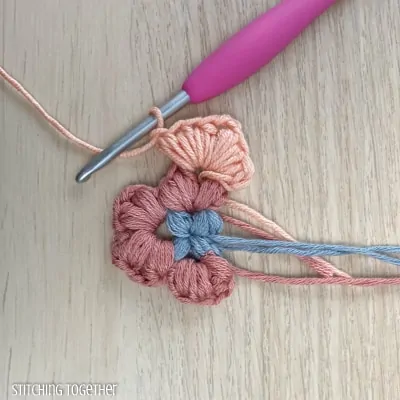 crocheting around adding more puff stitches to butterfly