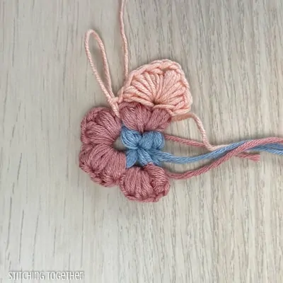 crocheting around adding more puff stitches to butterfly