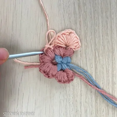 crocheting around adding more puff stitches to butterfly