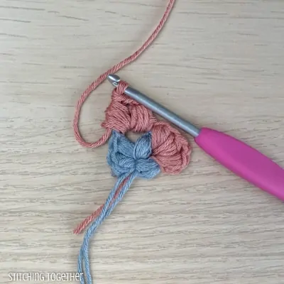 crocheting around adding more puff stitches to butterfly