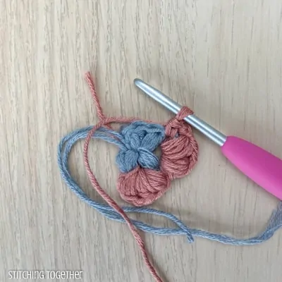 crocheting around adding more puff stitches to butterfly