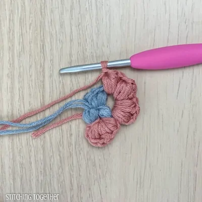 crocheting around adding more puff stitches to butterfly