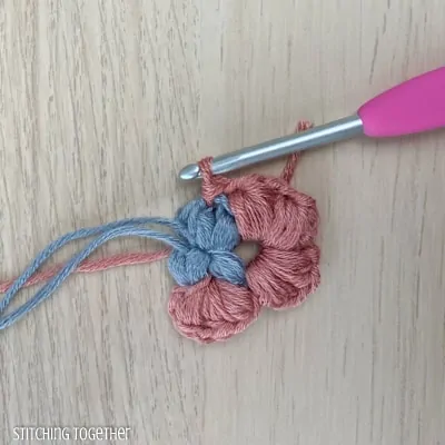 crocheting around adding more puff stitches to butterfly