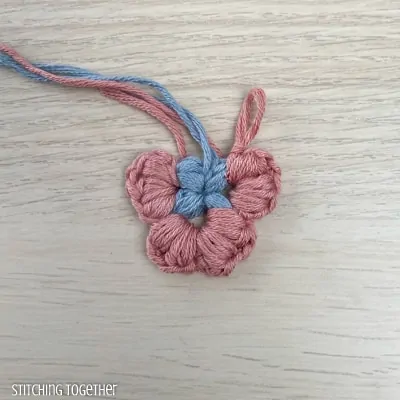 2 colors and rounds of puff stitches finished for butterfly