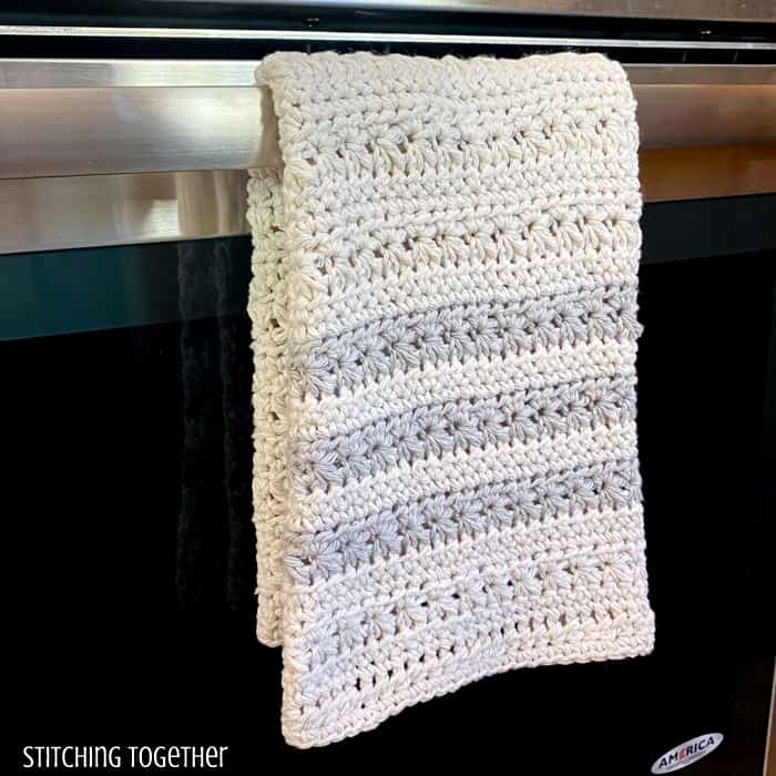 kitchen towel crochet draped on an oven handle