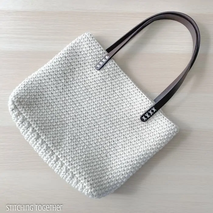 cream crochet shoulder bag with leather handles
