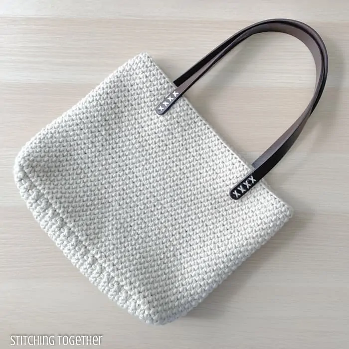 crochet shoulder bag in white with leather strap