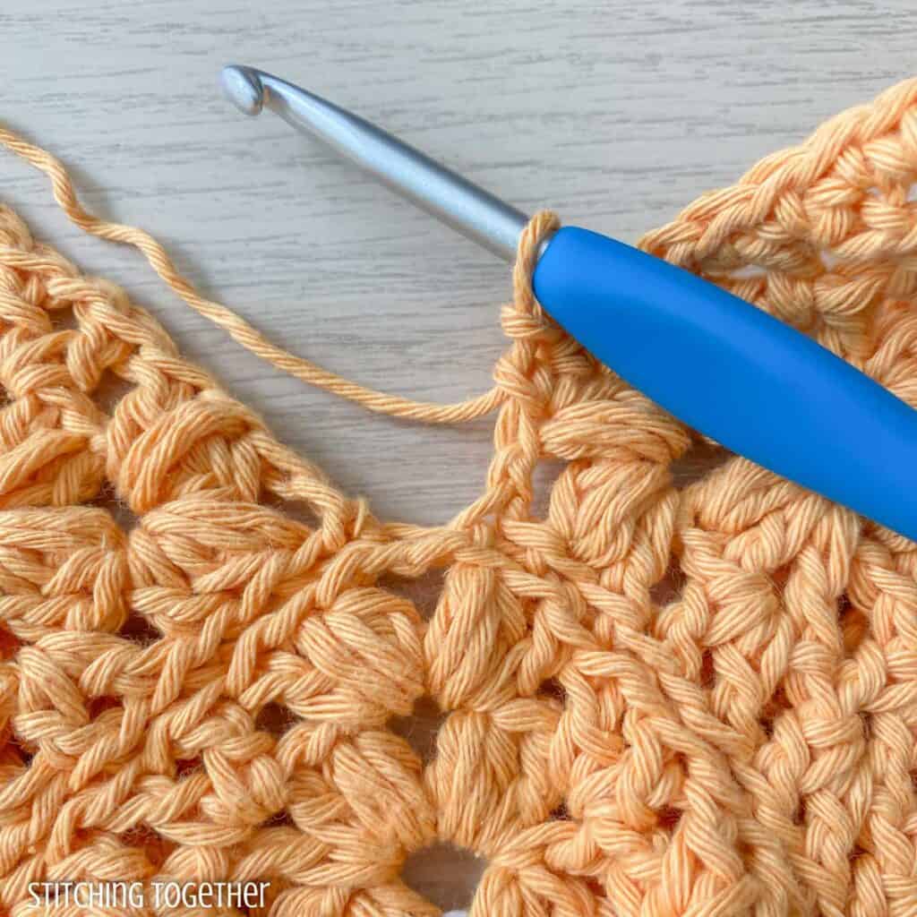 close up of crochet stitches showing where to place the next stitches