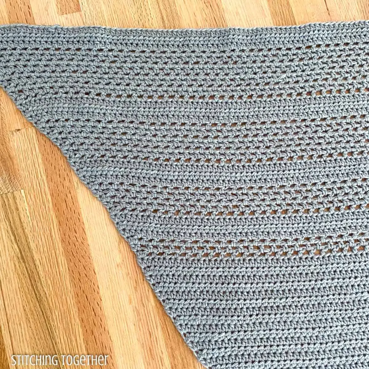 close up of crochet stitches in shawl