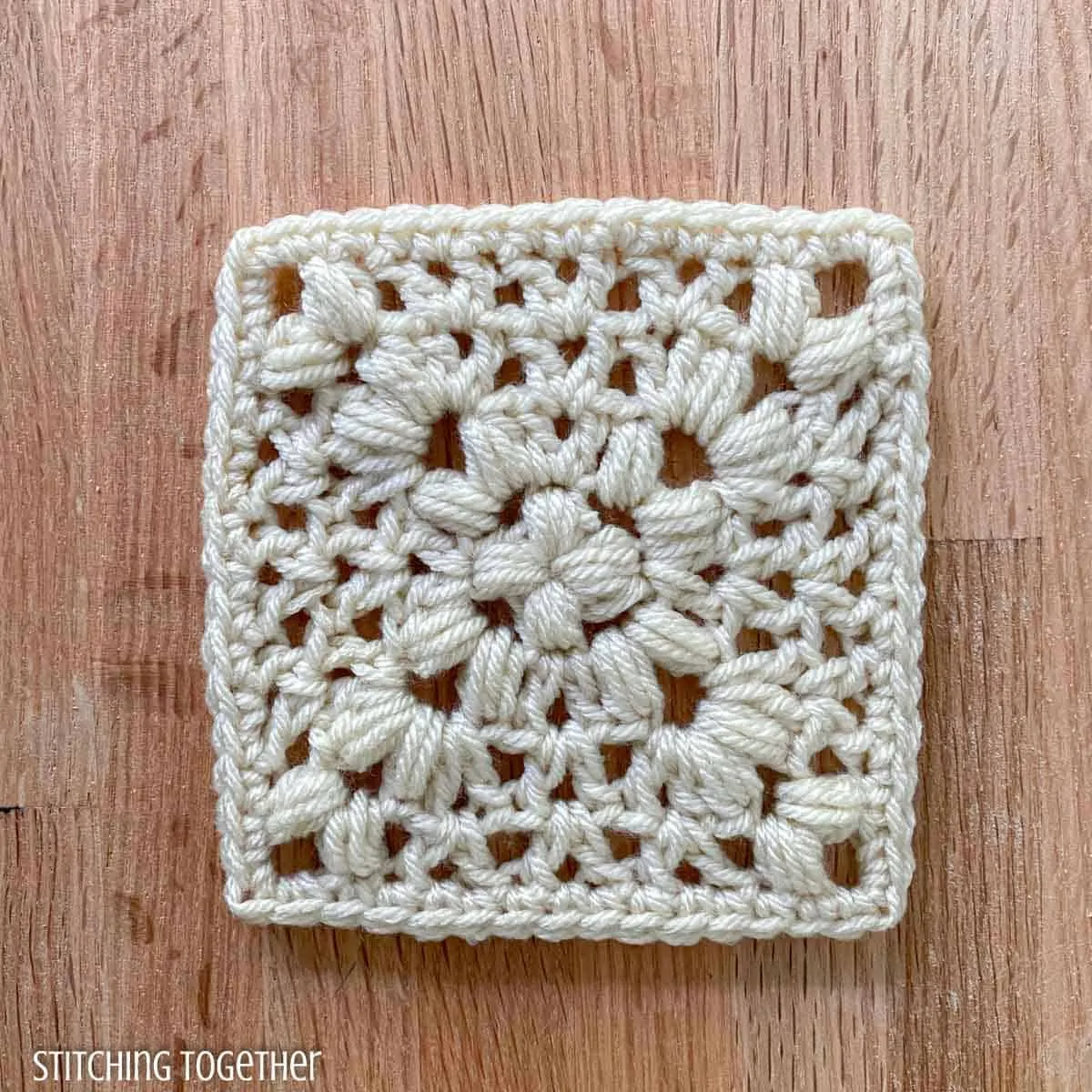 ivory crochet granny square with open stitches