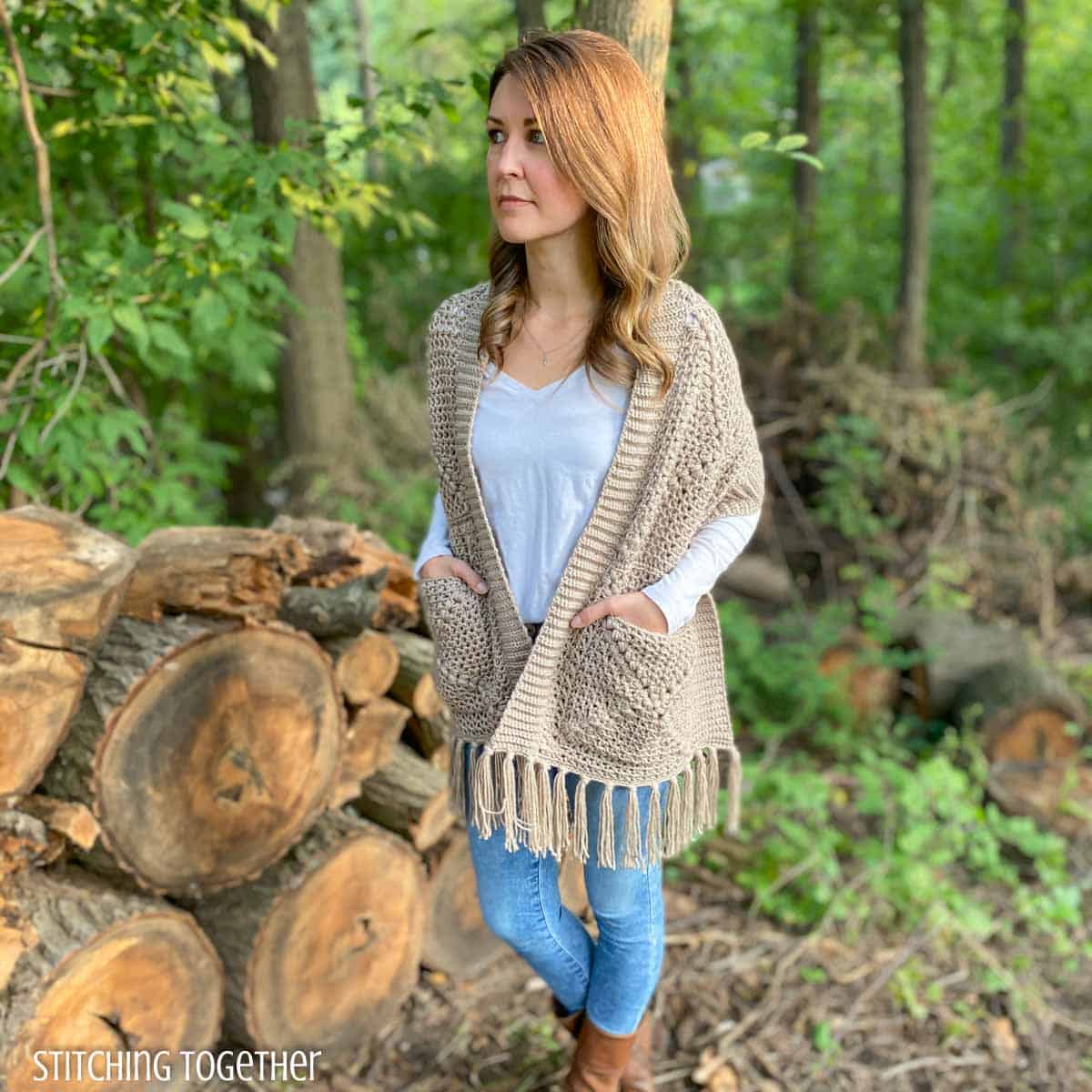 woman wearing a crocheted pocket shawl with fringe