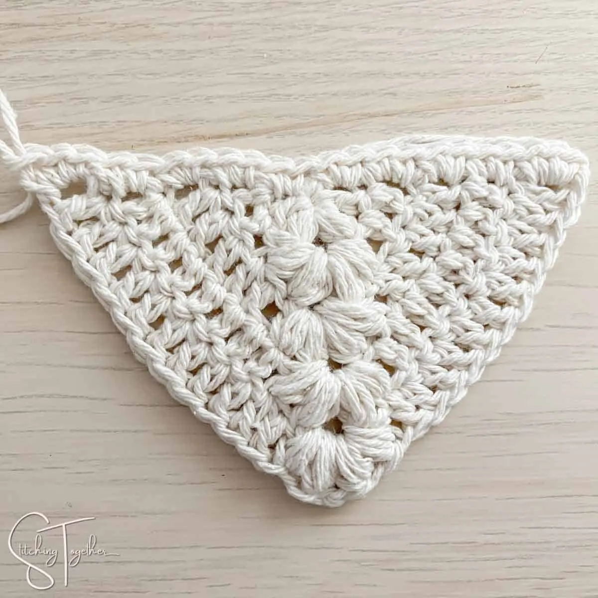 crochet triangle with puff stitches