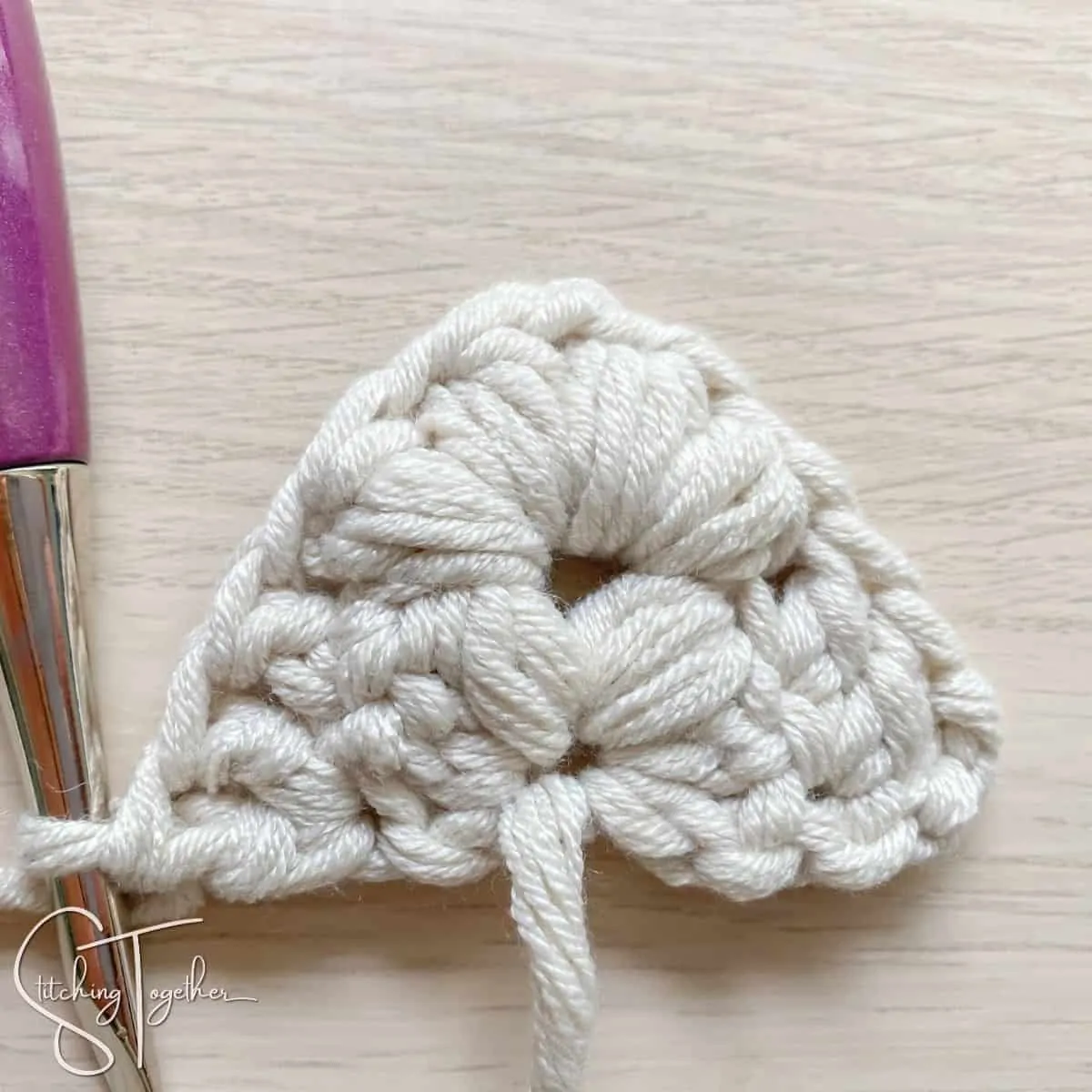 completed row 2 of a crochet triangle