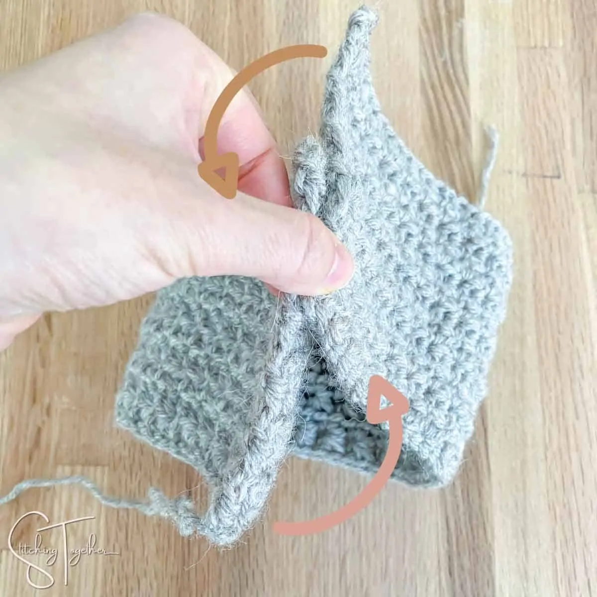 a crochet rectangle being folded together to make a headband