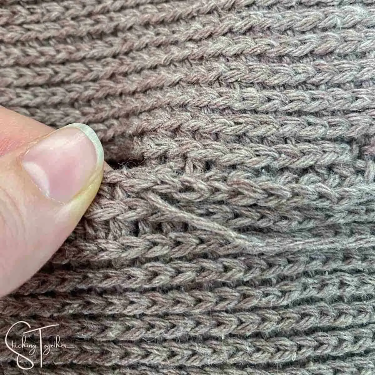 showing how to sew two crochet fabrics together