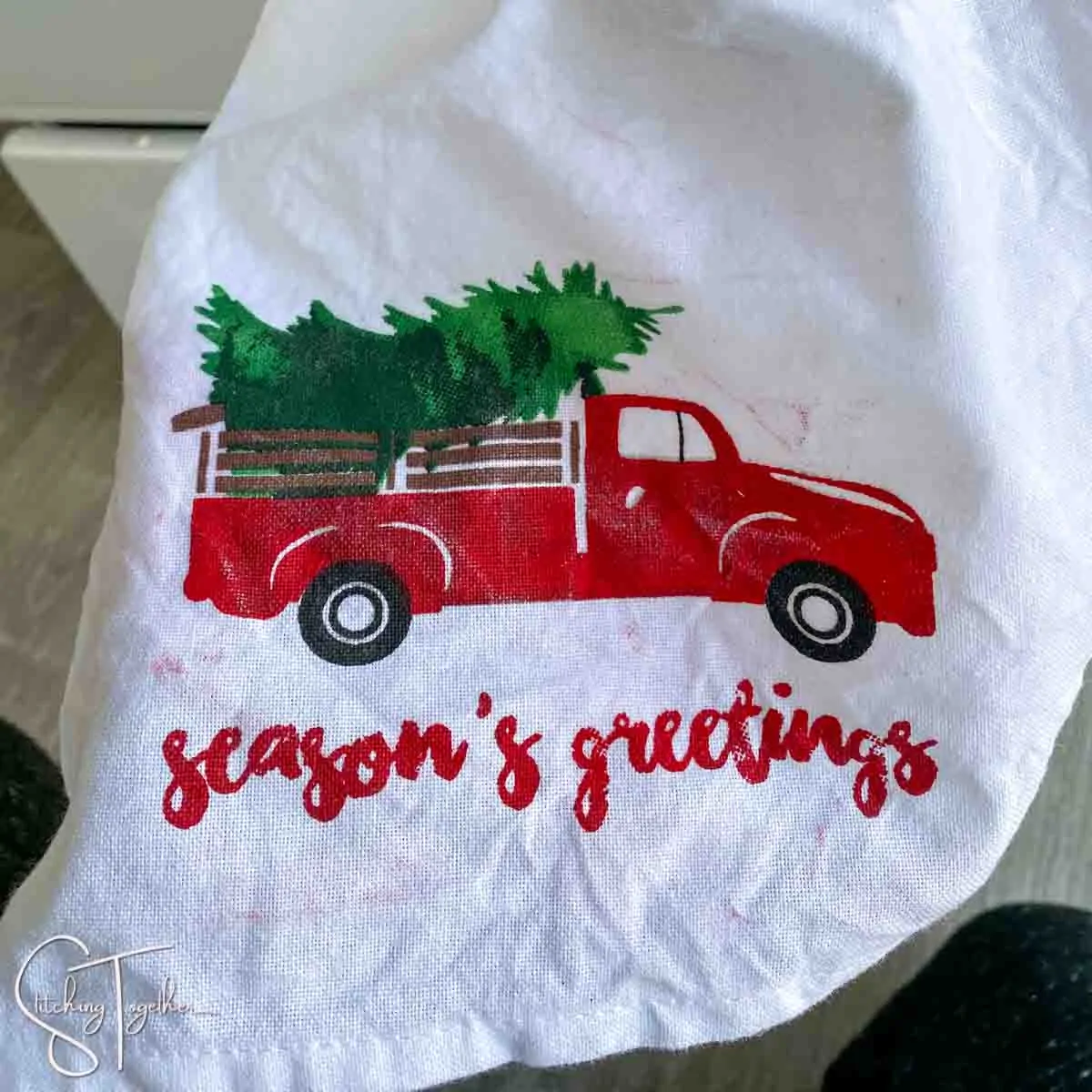 close up of bottom of dishtowel with red truck