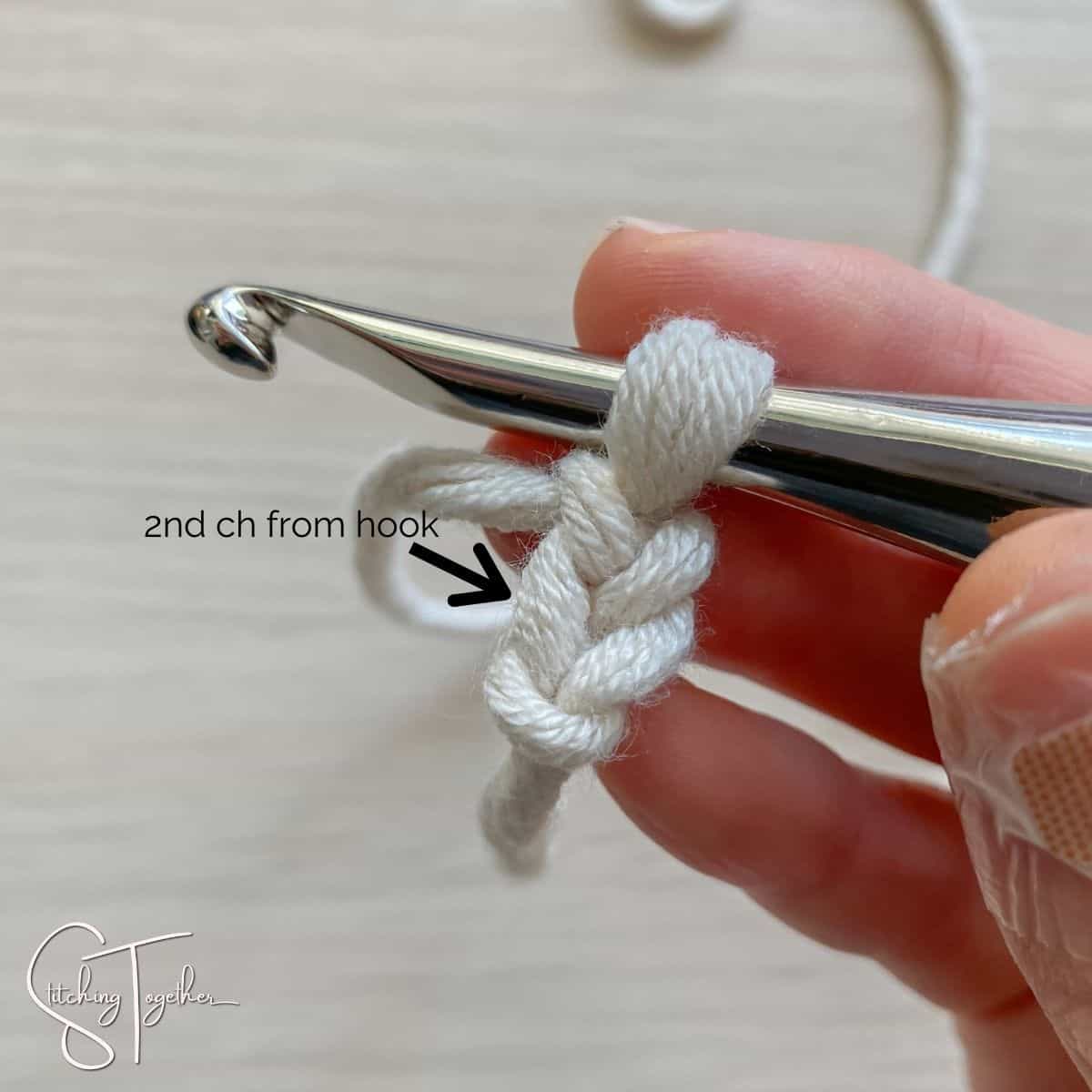crochet hook and yarn showing second chain from the hook