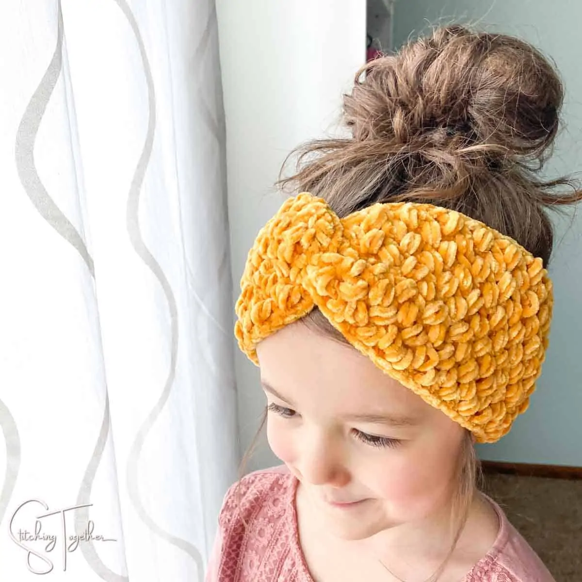 cute girl wearing a crochet twisted velvet headband