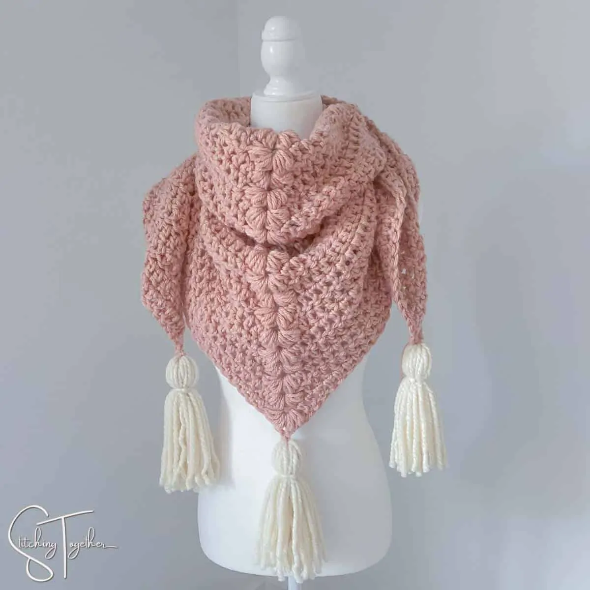 crochet chunky scarf on a mannequin