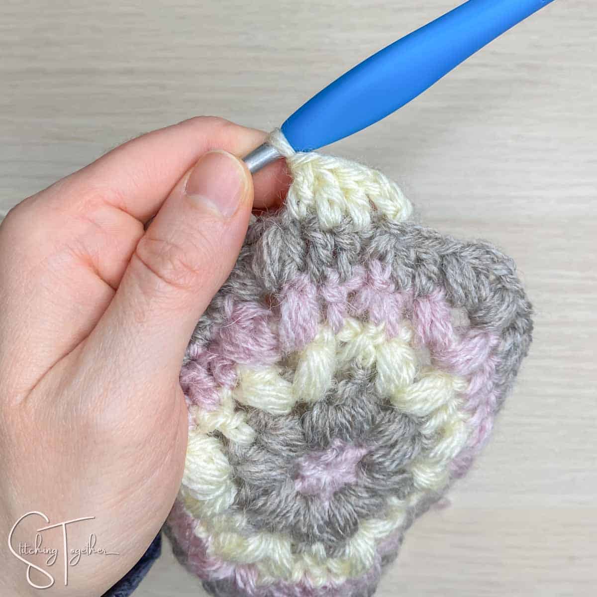 showing stitch placement for round 6 of a crochet hexagon
