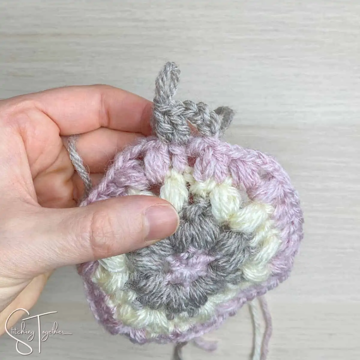 showing stitch placement for round 5 of a hexagon crochet