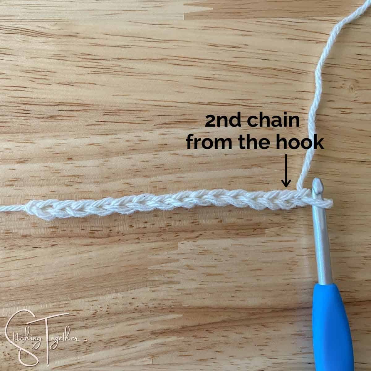 crochet chain and hook with instructions showing where to find the 2nd chain
